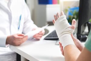 Man speaking with a Doctor after getting bitten by a dog